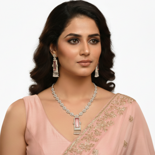 Woman wearing a pink saree  pink jewellery on a white background