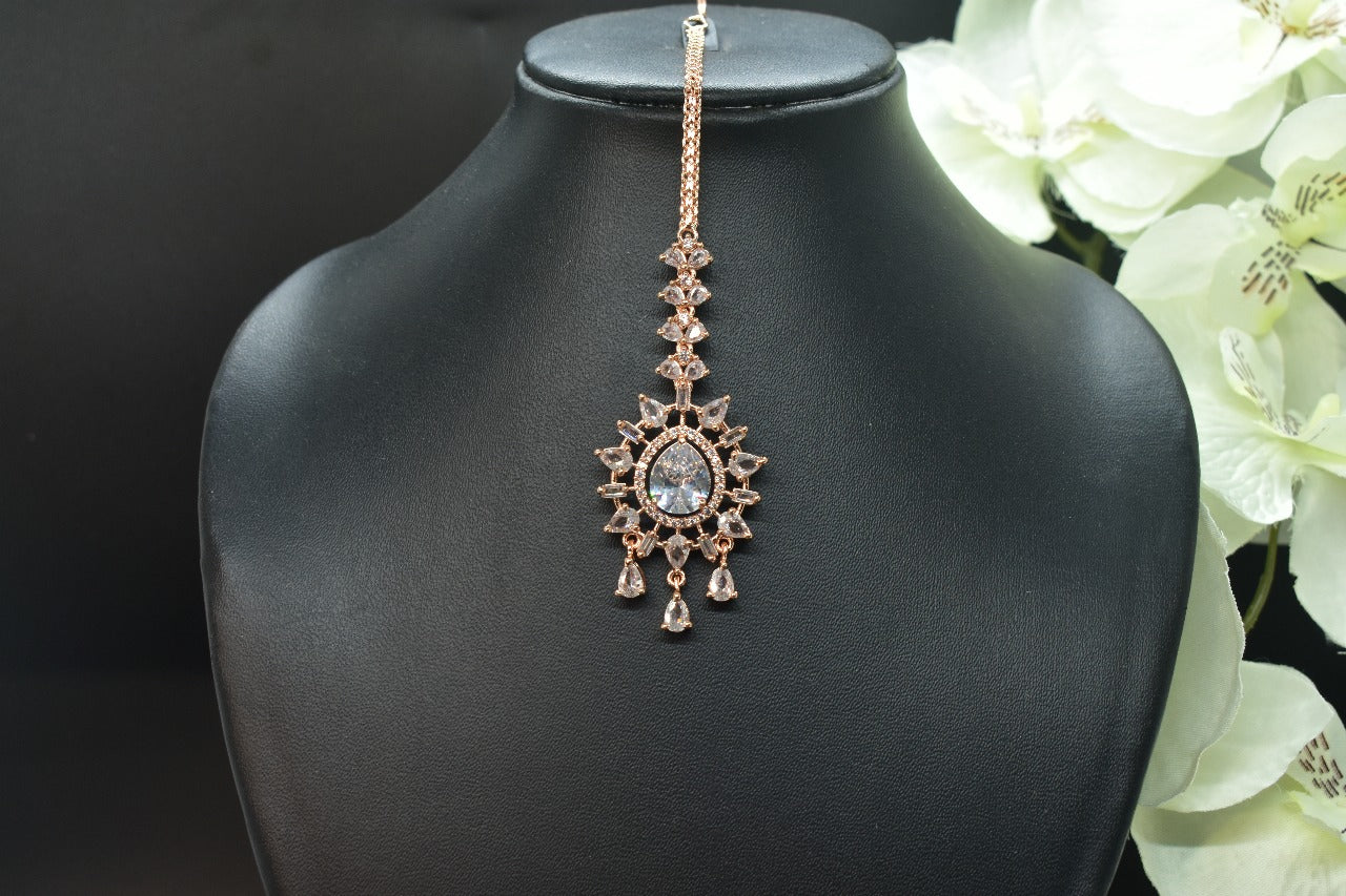 AD rosegold round shaped mangtikka with silver gemstones and AD drops