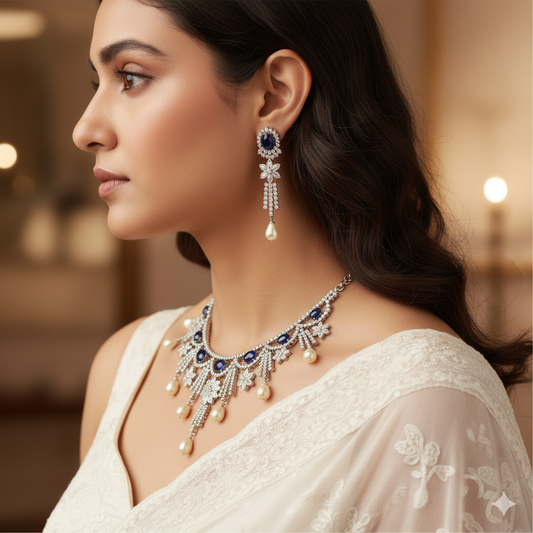 Woman wearing a necklace and earrings with a blurred background