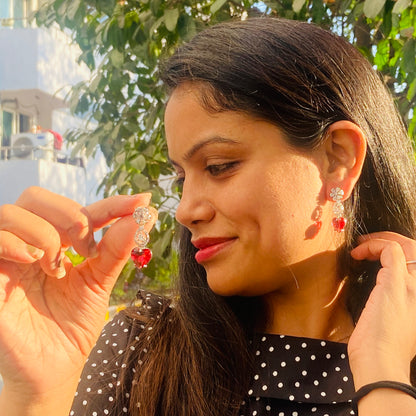 Woman wearing a AD Red earrings studs