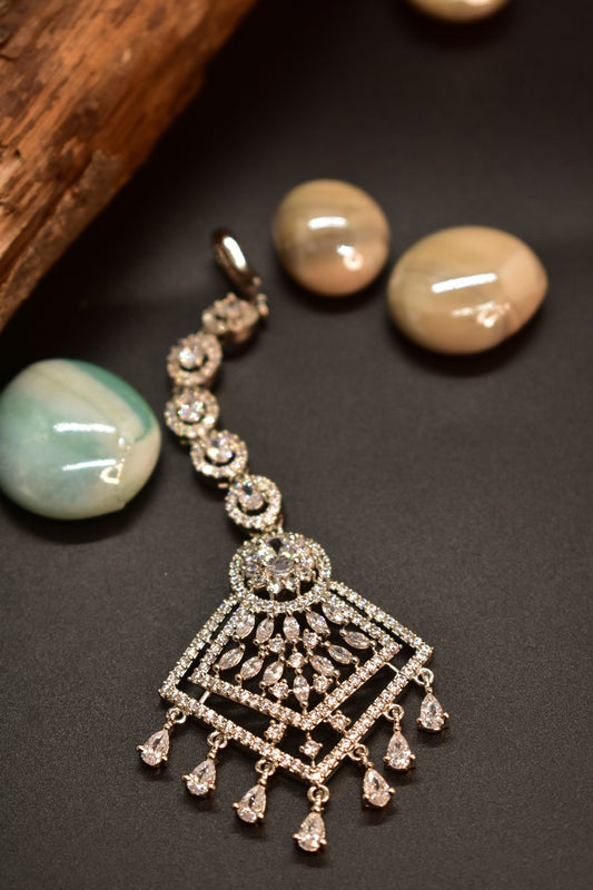 AD Silver Mang tikka with Silver gemstones on a adark background