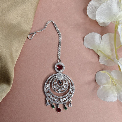 Round Shaped AD Mangtikka with colourful AD stone drops on a floral background