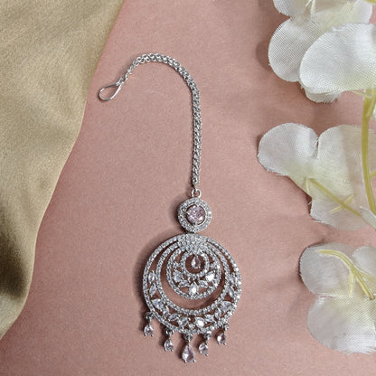 Ad Silver Mangtikka with Stone derops on a floral background