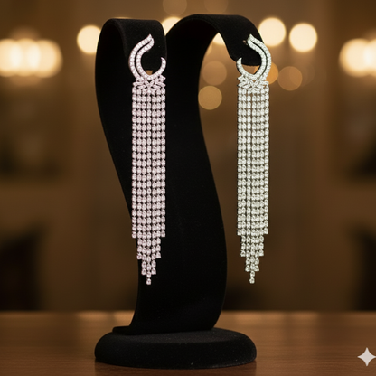 Pair of long, Zircon earrings on a black stand 